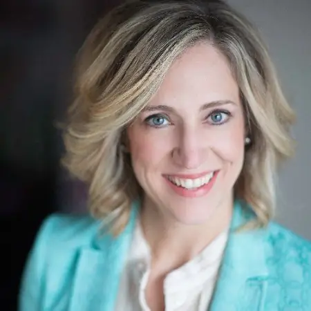 Headshot of Heather Harris-Keliiheleua, a smiling woman with shoulder-length blonde hair wearing a teal blazer.
